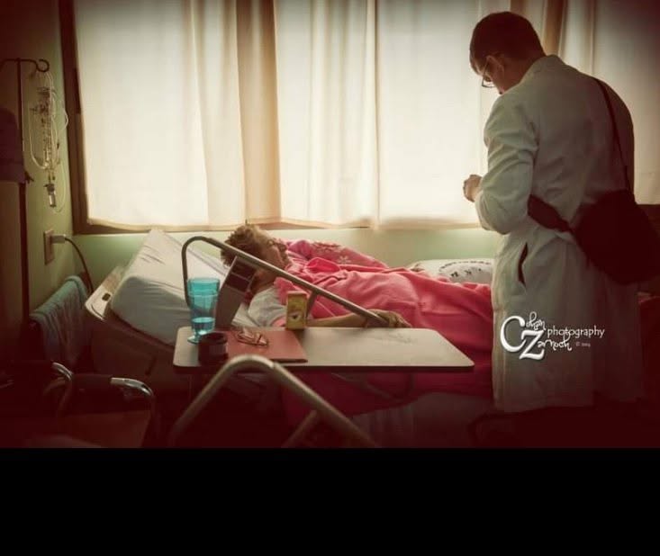 Dr. Daines at the bedside of a patient during morning rounds