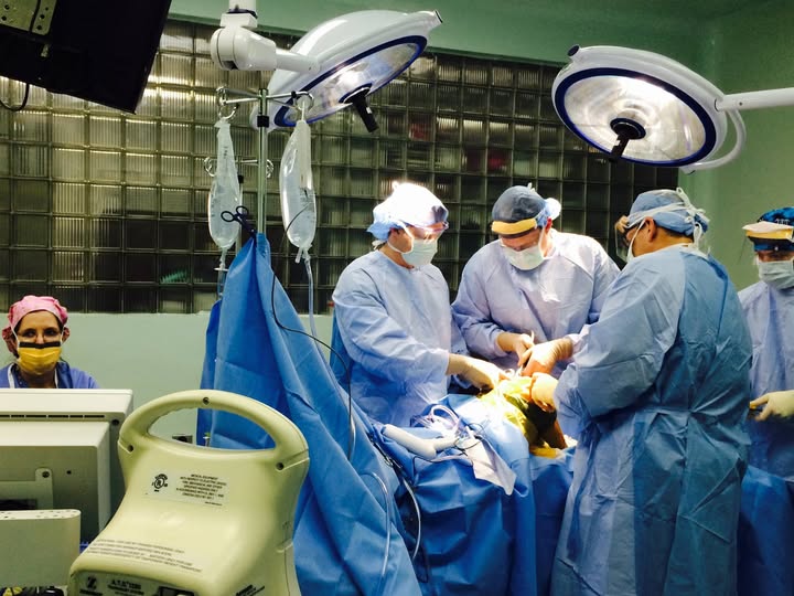 Dr. Daines and the surgical team performing a joint replacement in the operating room